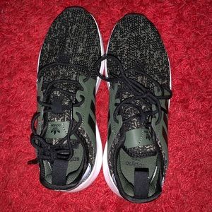 Green and black adidas sneakers